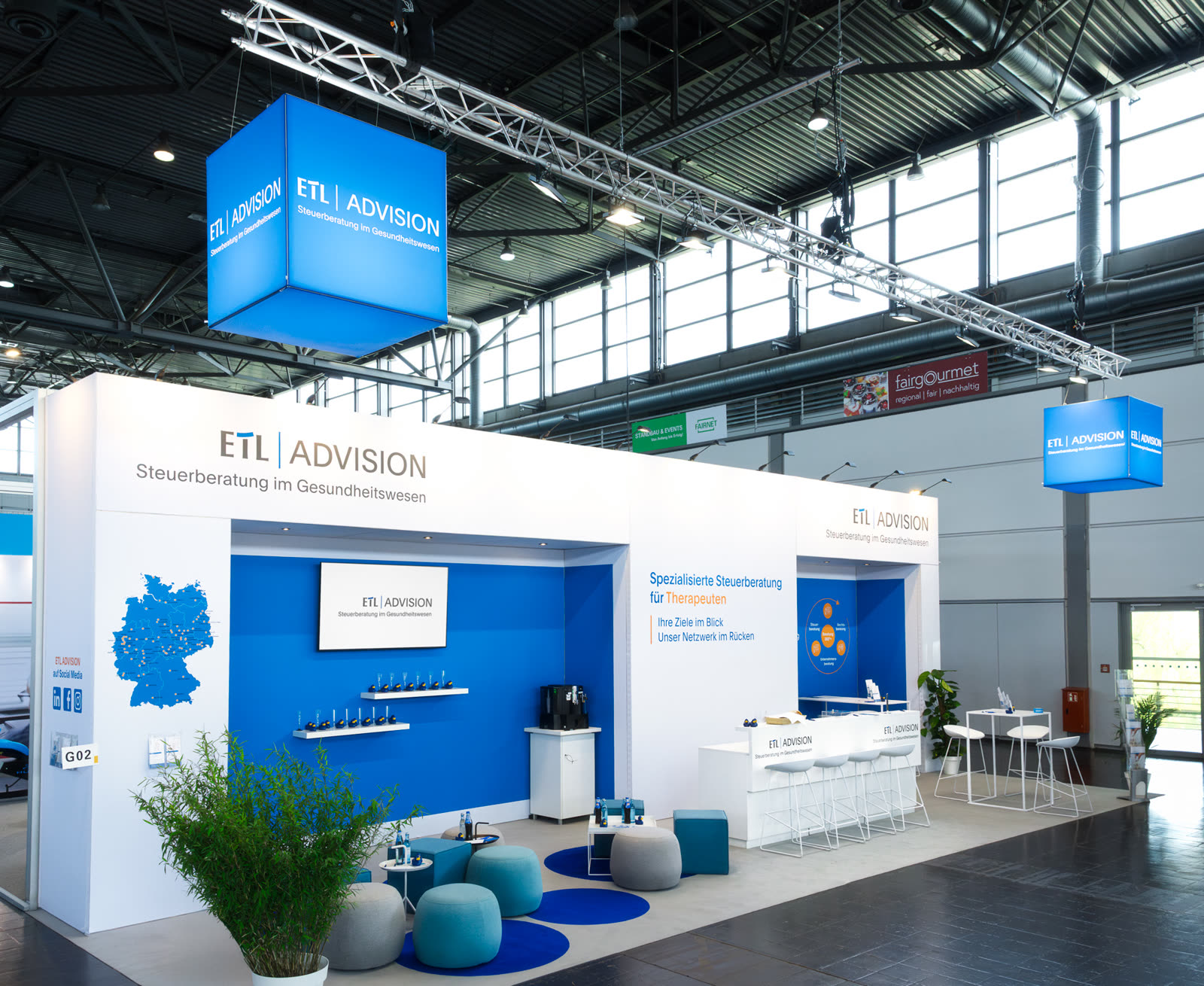 Messestand ETL Advision – zweigeschossiger Individualbau, Messebau aus Hamburg
